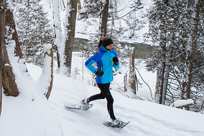 Person running in snowshoes